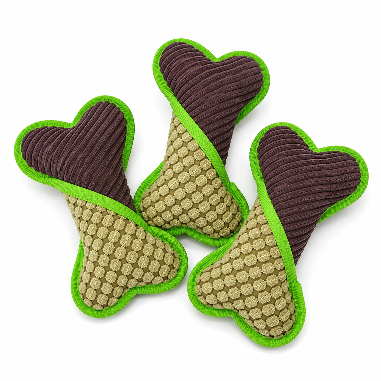 Three dog toys shaped like bones with brown centers, green edges, and textured surfaces on a white background.