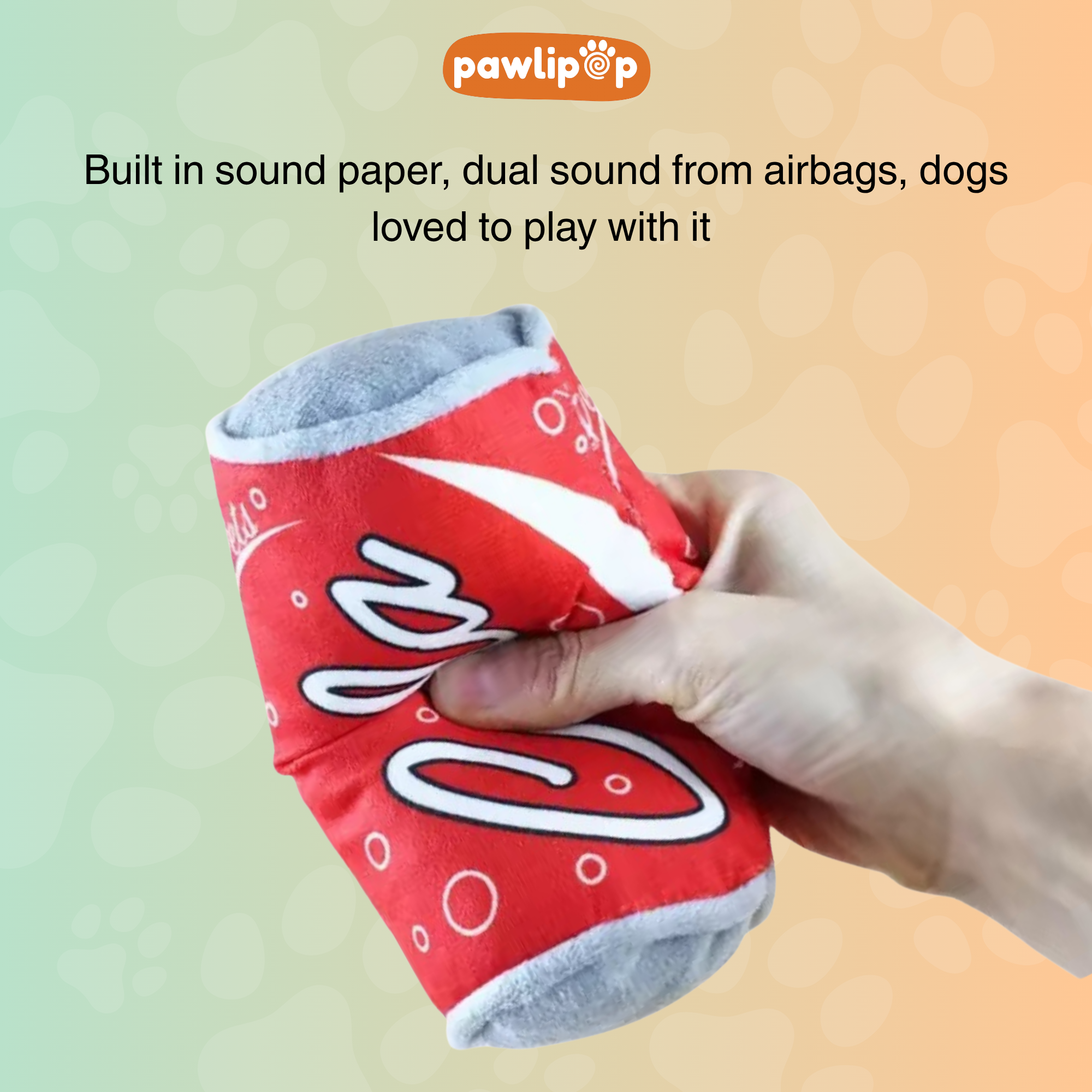 cola dog toy with 'Pawlipop' branding, held by a hand against sound paper